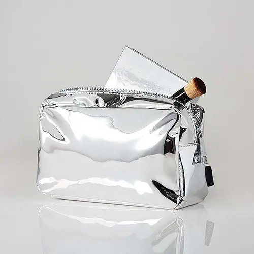 Wholesale Metallic Makeup Bag with Essential Tools | Luxurious Silver Cosmetic Organizer for Beauty Brands & Retailers